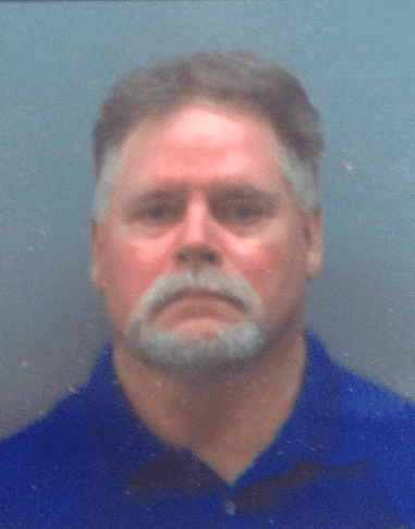 Man with gray hair and mustache.