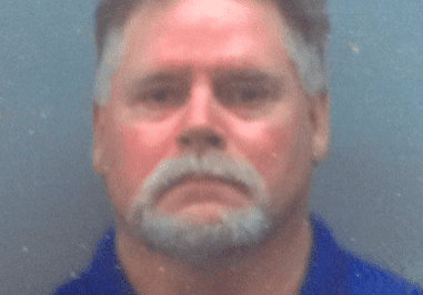 Man with gray hair and mustache.